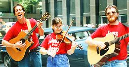 [Music group performing on city street (16K color JPEG)]